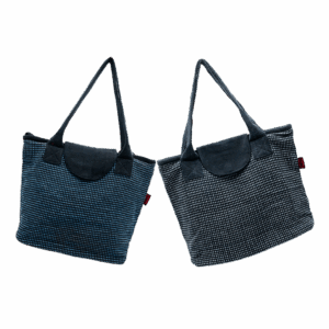 A tote bag with a blue/white and black pattern